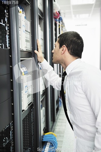 Image of young it engeneer in datacenter server room