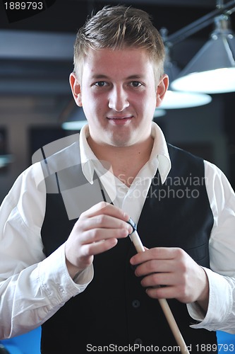 Image of young man play pro billiard game 