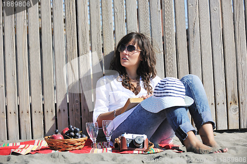 Image of happy young woman on beach
