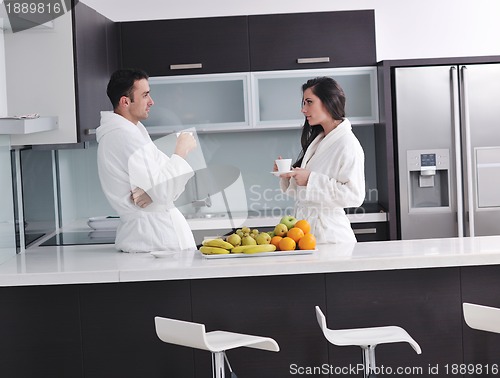 Image of young couple have fun in modern kitchen