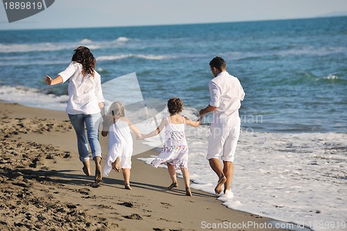 Image of happy young  family have fun on beach