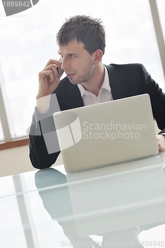 Image of young business man talk by cellphone