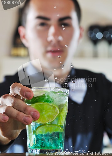 Image of pro barman prepare coctail drink on party