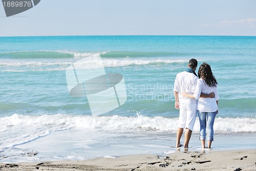 Image of happy young couple have fun at beautiful beach