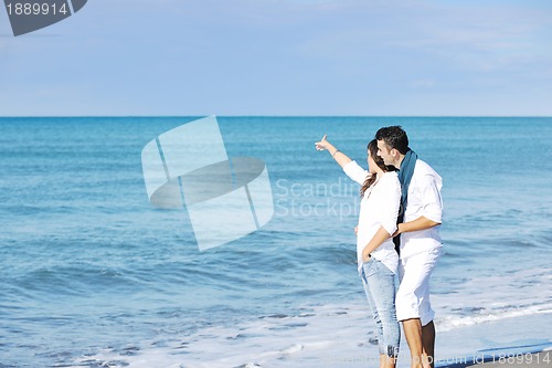 Image of happy young couple have fun at beautiful beach