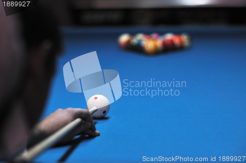 Image of young man play pro billiard game 