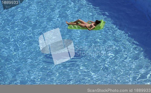 Image of woman relax at swimming pool 