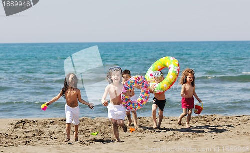 Image of child group have fun and play with beach toys