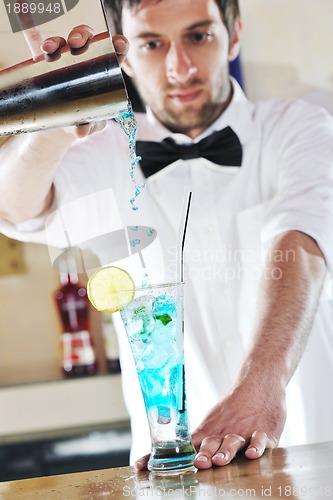 Image of pro barman prepare coctail drink on party