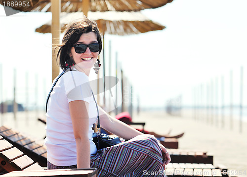 Image of young woman relax  on beach