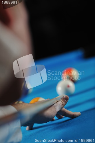 Image of young man play pro billiard game 