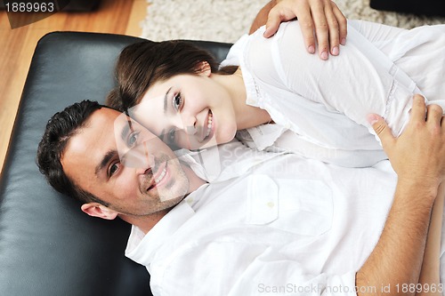 Image of happy young couple relax at home