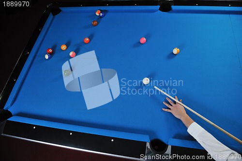 Image of young man play pro billiard game 