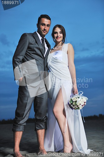 Image of romantic beach wedding at sunset