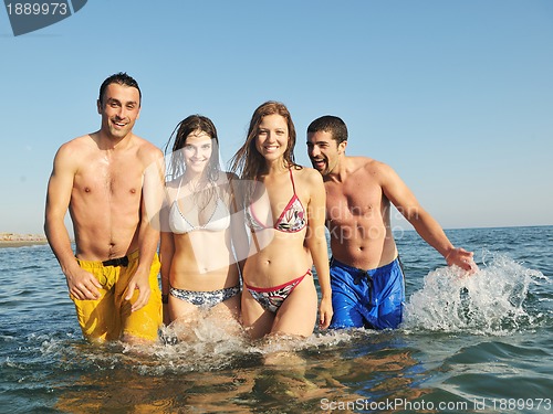 Image of happy young  people group have fun on beach