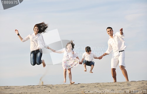 Image of happy young family have fun on beach