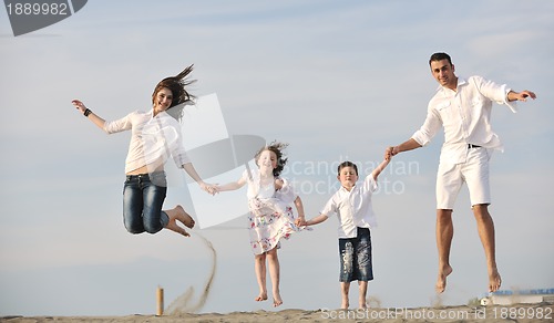 Image of happy young family have fun on beach