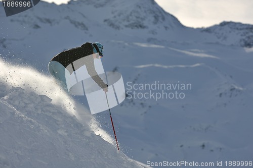 Image of woman skiing on fresh snow at winter season 