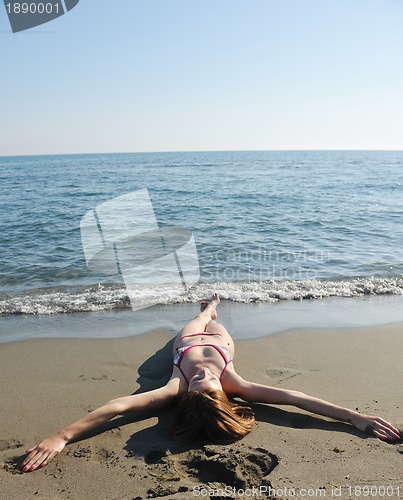 Image of young woman relax  on beach