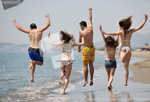 Image of happy young  people group have fun on beach