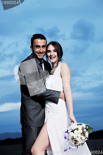 Image of romantic beach wedding at sunset