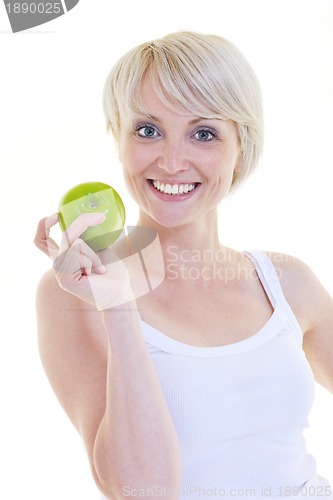 Image of happy  young  woman eat green apple isolated  on white