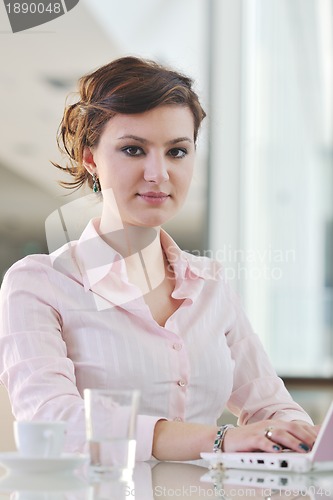 Image of young business woman on meeting