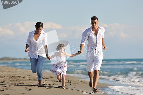 Image of happy young  family have fun on beach