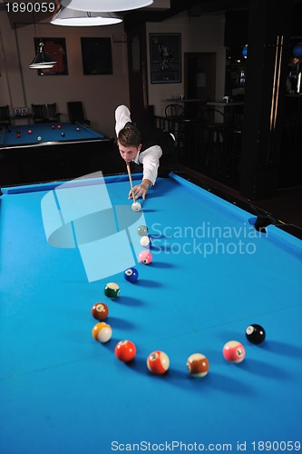 Image of young man play pro billiard game 