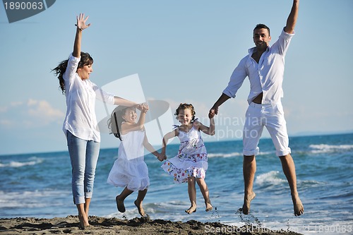 Image of happy young  family have fun on beach