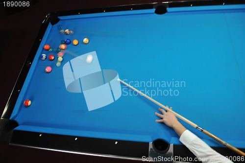 Image of young man play pro billiard game 