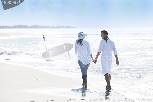 Image of happy young couple have fun at beautiful beach