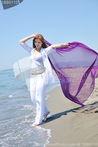 Image of young woman relax  on beach