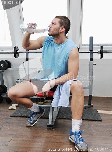 Image of man drink water at fitness workout