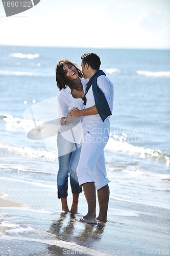 Image of happy young couple have fun at beautiful beach