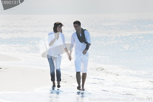 Image of happy young couple have fun at beautiful beach