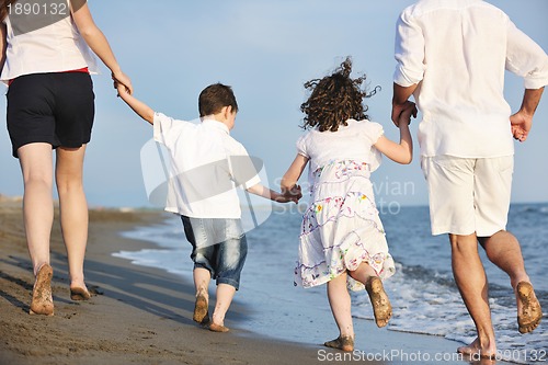 Image of happy young family have fun on beach