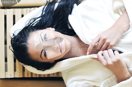 Image of Young woman take a steam bath
