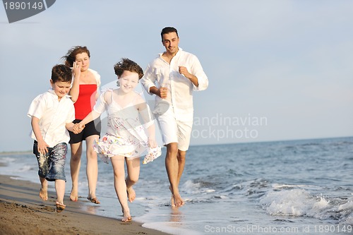 Image of happy young family have fun on beach