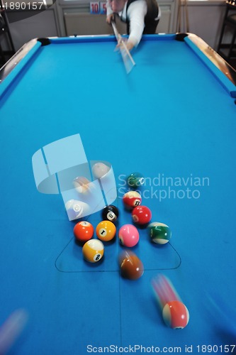 Image of young man play pro billiard game 