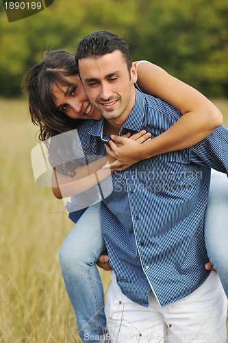 Image of happy young couple have romantic time outdoor