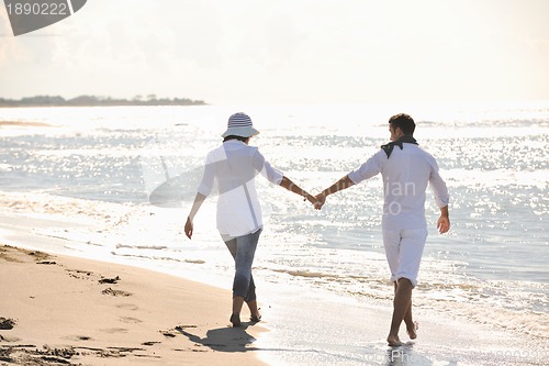 Image of happy young couple have fun at beautiful beach