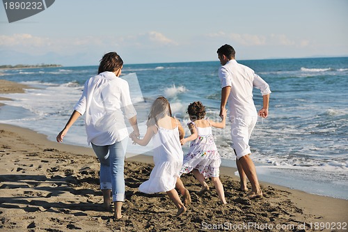 Image of happy young  family have fun on beach