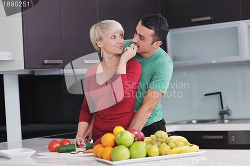 Image of young couple have fun in modern kitchen