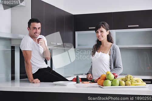 Image of young couple have fun in modern kitchen