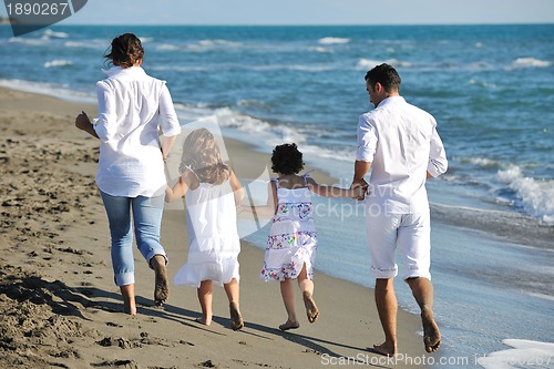 Image of happy young  family have fun on beach