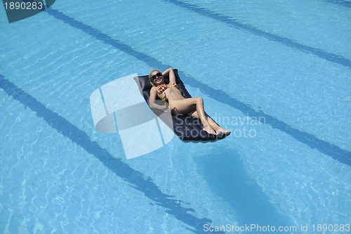 Image of woman relax on swimming pool