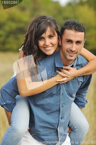 Image of happy young couple have romantic time outdoor