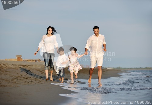 Image of happy young family have fun on beach
