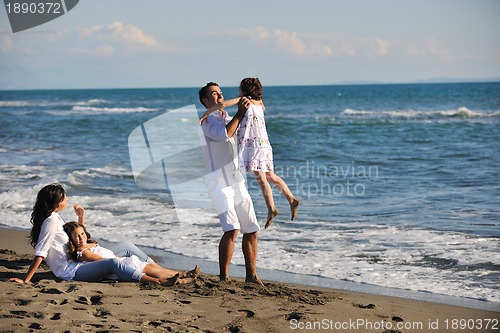 Image of happy young  family have fun on beach